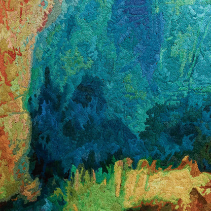 A close-up of a thread tapestry with a textured, abstract design, showcasing intricate stitching and colorful thread.