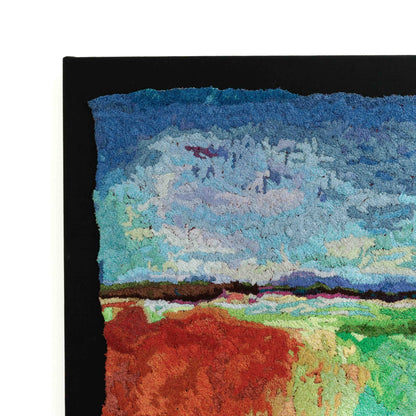 A close-up of a thread tapestry with an abstract landscape, showcasing intricate stitching and colorful thread.