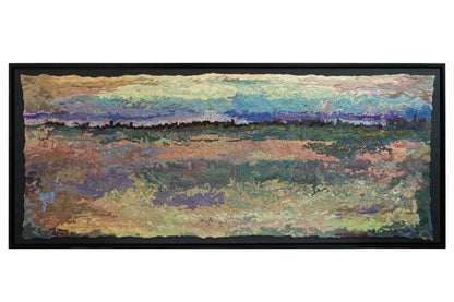 A wide, rectangular thread tapestry with a landscape design, showcasing intricate stitching and colorful thread.