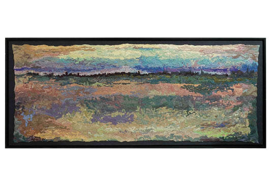 A wide, rectangular thread tapestry with a landscape design, showcasing intricate stitching and colorful thread.