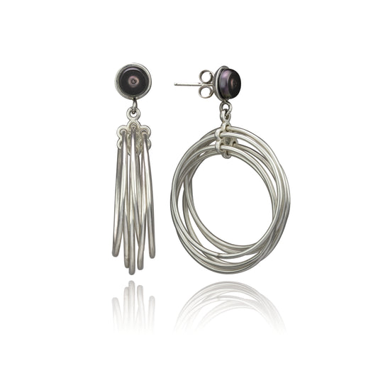 Two Edna Milevsky Spirograph Hoop Earrings, each with a dark pearl and cascading silver elements.