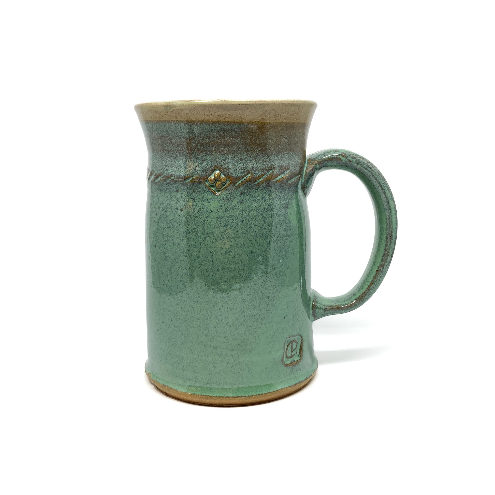 Seafoam green glazed ceramic stein with a textured rope design and a circular maker's mark near the base.