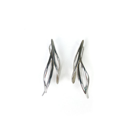 Pair of shiny silver willow earrings, angled view showing their curved, open design.