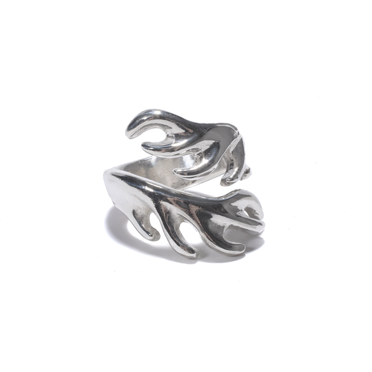 A shiny silver ring wraps around with stylized, branching forms resembling elk antlers.