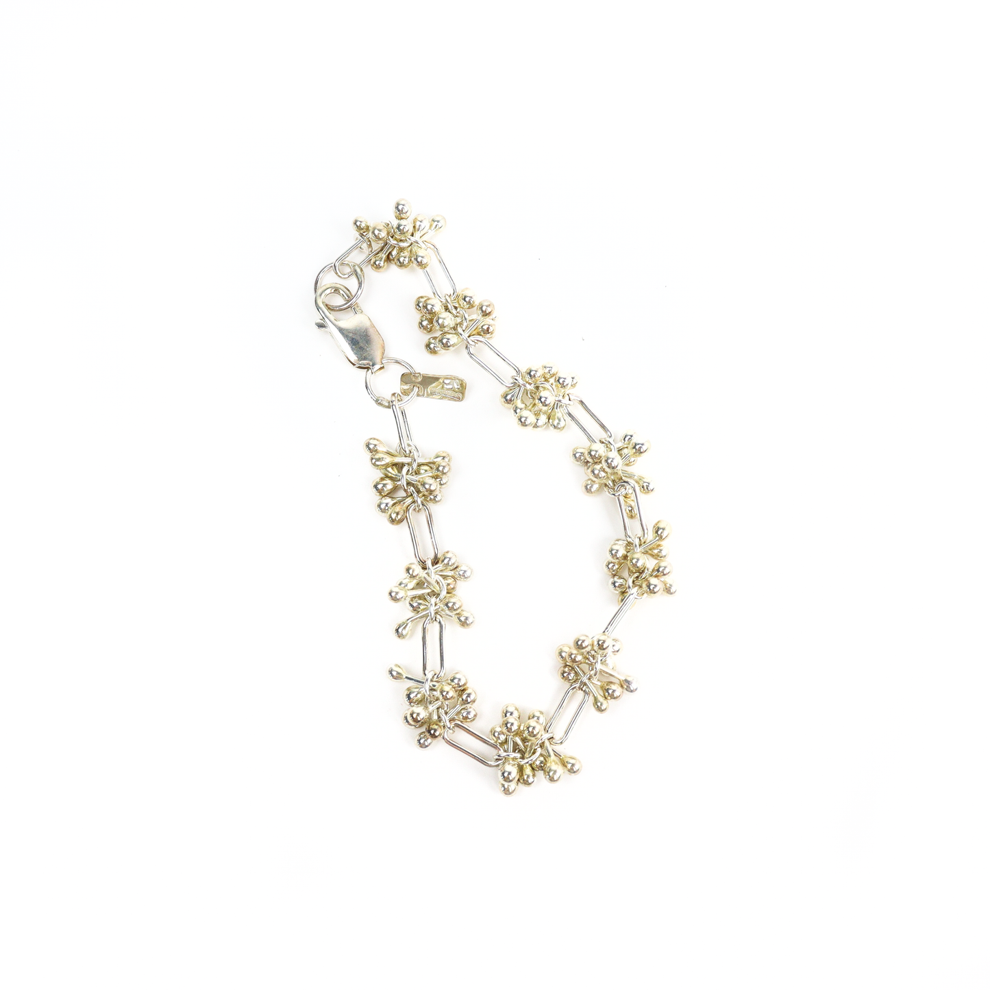 Top view of Spaced Barbell Bracelet with alternating silver ball clusters and rectangular links.