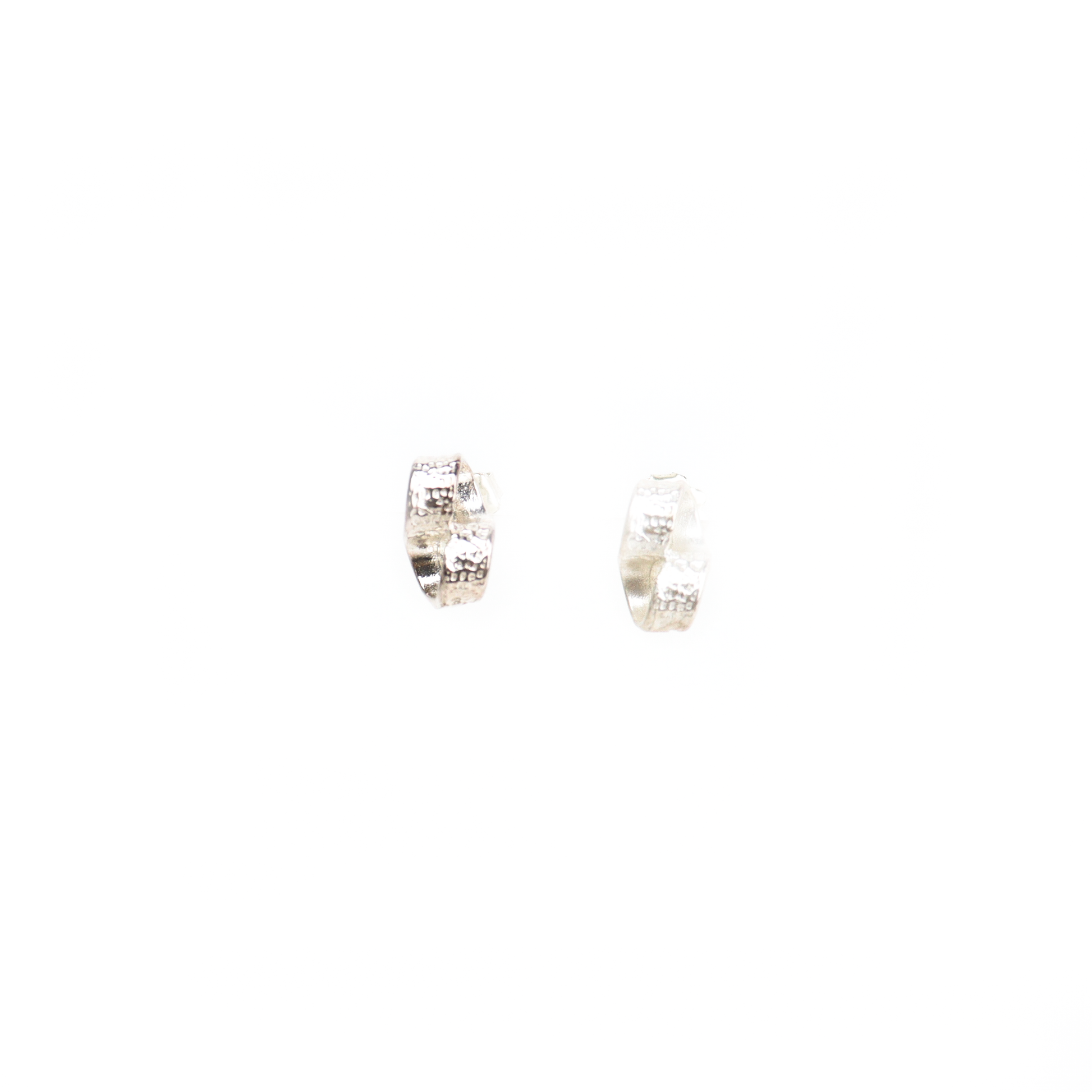 Front view of New York Button Studs highlighting hammered texture and looped silver shape.