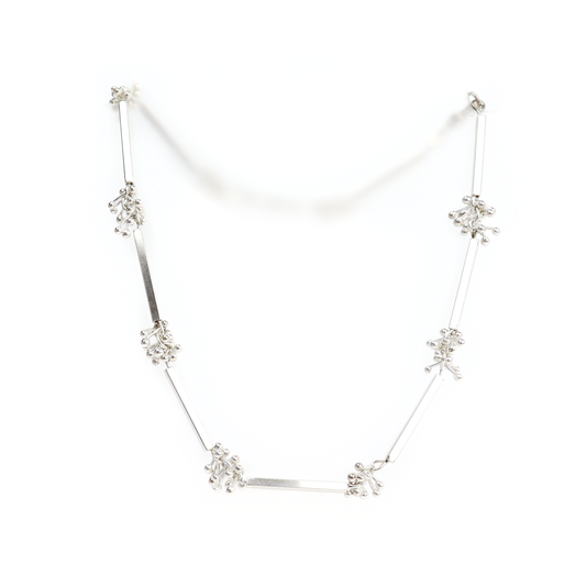 Square Tube Barbell Necklace featuring silver bars connected by clusters of small silver balls.
