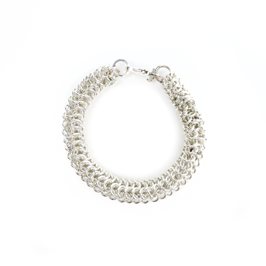 Thick Chain Mail Bracelet crafted from interwoven silver rings with a toggle clasp.