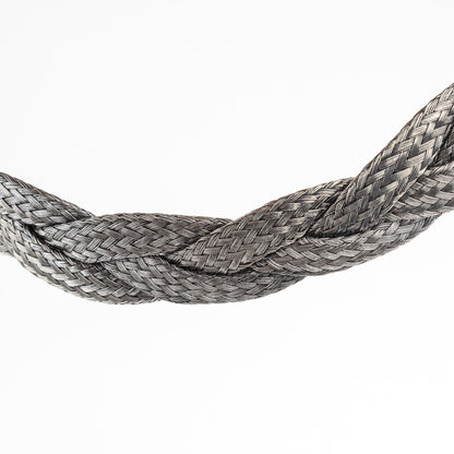 Close-up of a braided stainless steel necklace section.