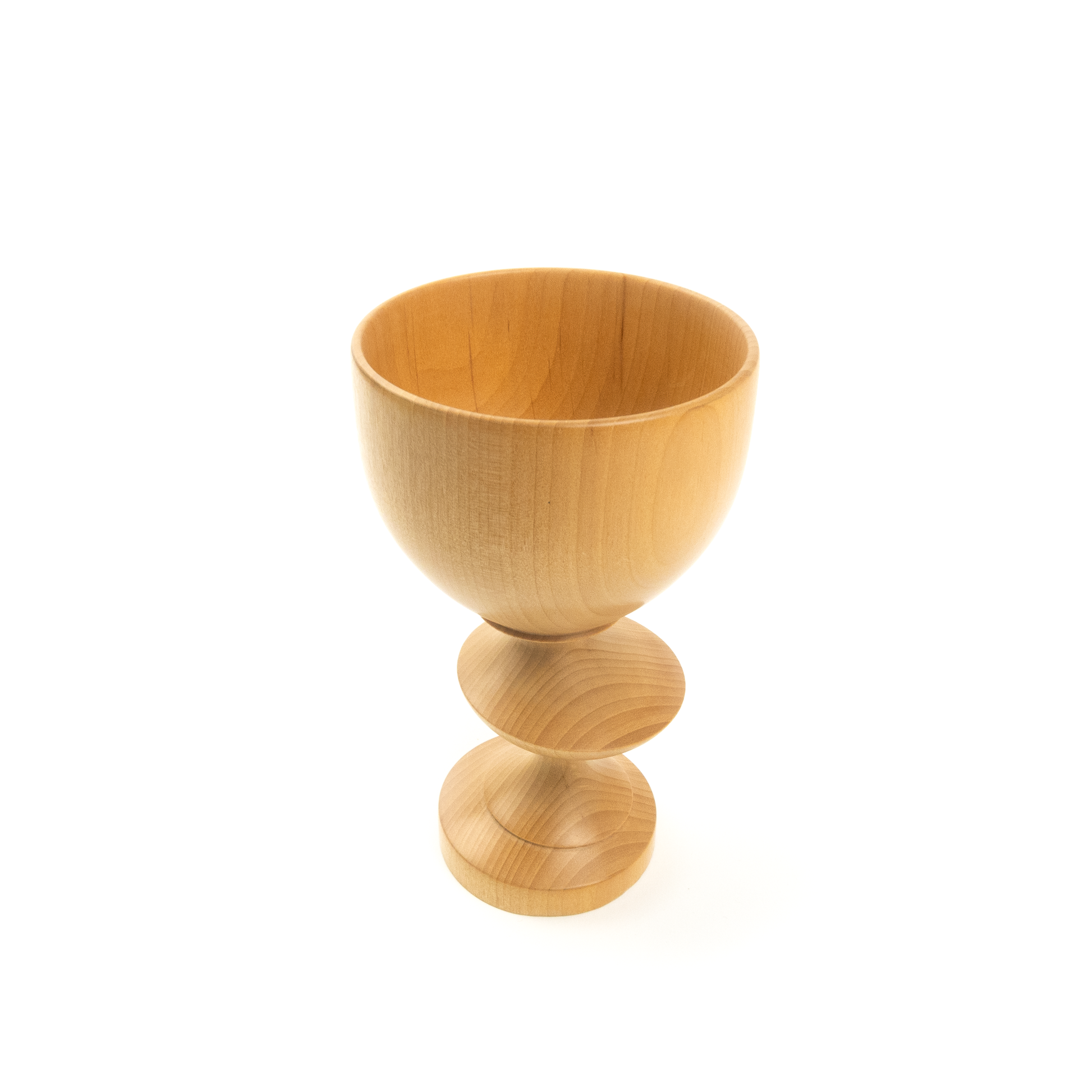 A light brown wooden goblet with a rounded bowl and a twisted stem, angled view.