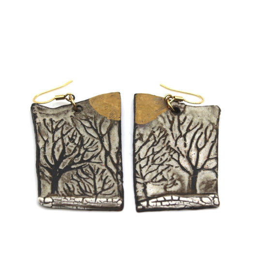 Rectangular earrings with tree designs, gold hooks, and a gold accent at the top.
