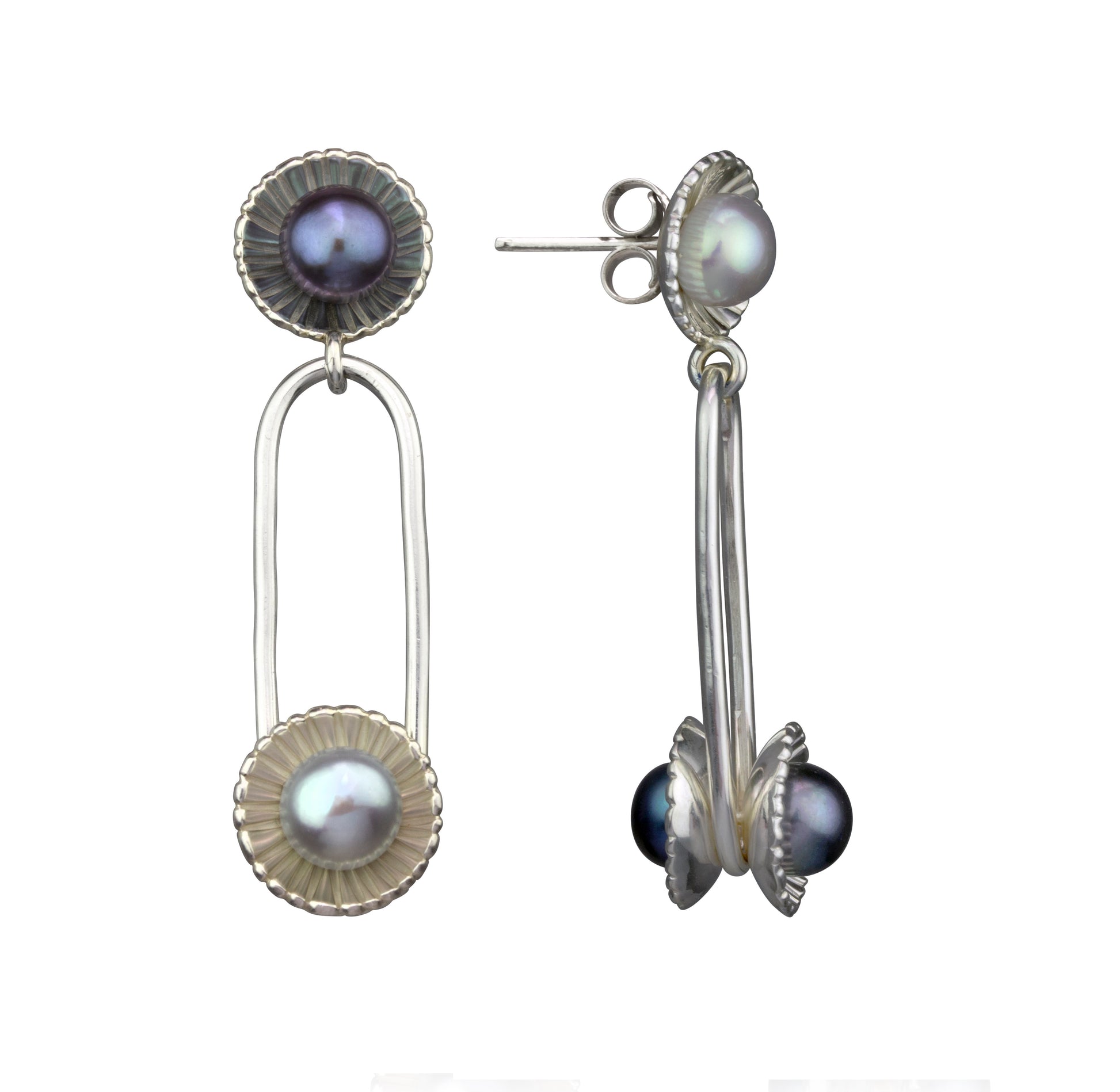 Two mismatched silver drop earrings, each with two iridescent pearls in textured, scalloped settings.