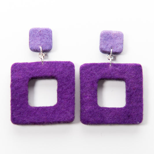 Two purple felt earrings with silver hooks. Each earring features a small square above a larger hollow square.