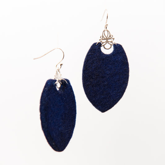 Two navy blue felt earrings with silver hooks and decorative caps.